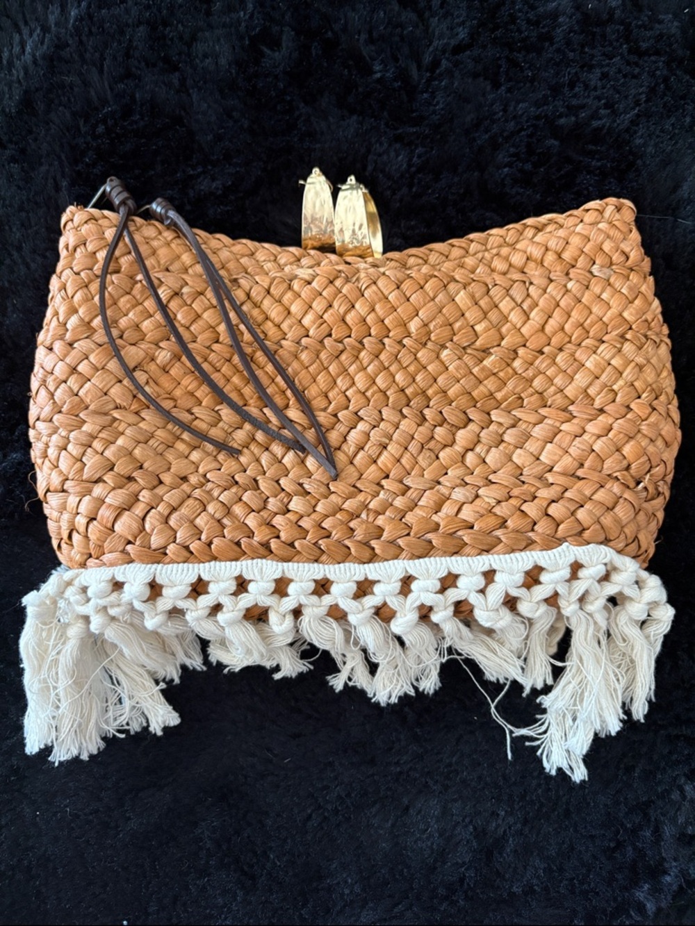 Clutch with gold hoop earrings
